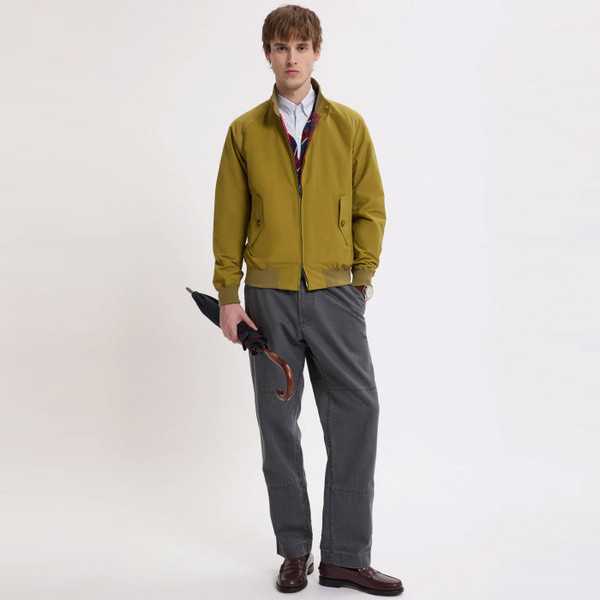 Man wears Baracuta G9 Made In England Mod Harrington Jacket in Moss Green