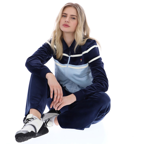 Woman sitting on floor wearing Fila Vintage Womens Giovana 80s Cropped Velour Zip Track Top in Navy Blue
