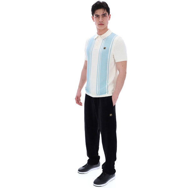 Man wears Fila Vintage Mens Gold Buddy Bowling Style Knitted Polo Shirt in Coconut Milk white