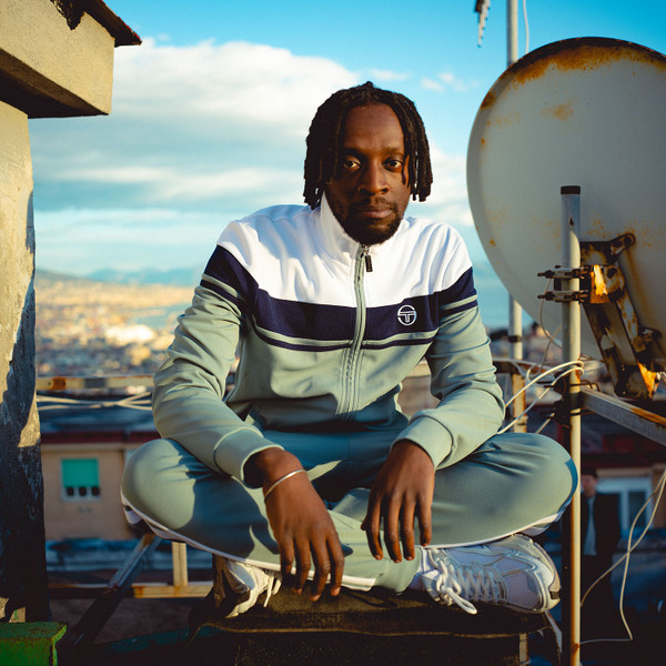 Lifestyle photo of Man wearing Sergio Tacchini Damarindo Retro 80s Casuals Track Top in Grey/White