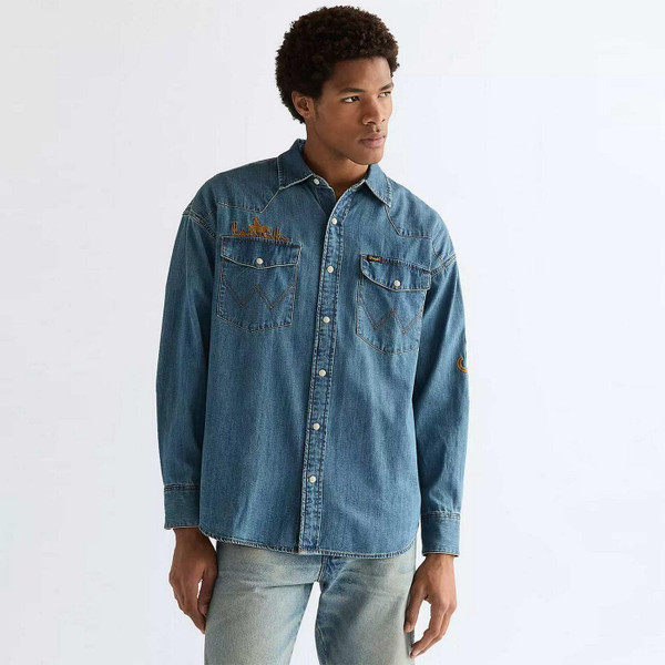 Model Wearing Wrangler Men's Retro 1980s Oversized Denim Western Shirt with Embroidery in Trail Blazer Blue