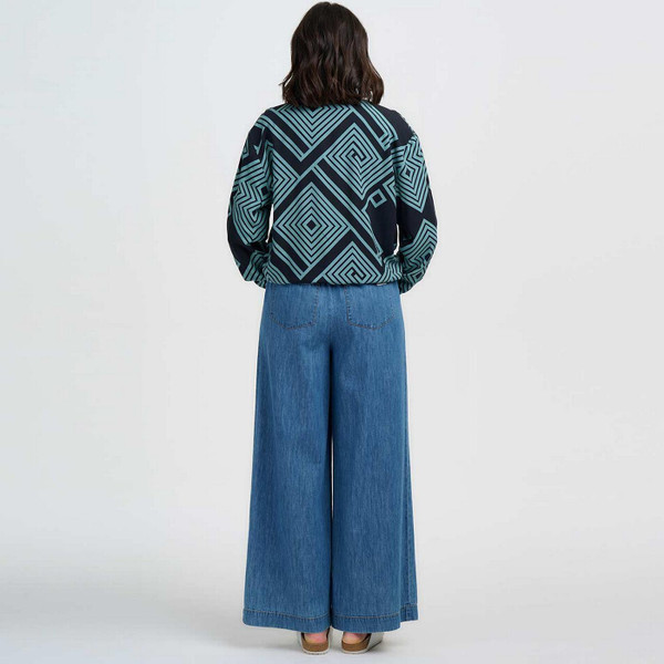 Model Wearing Sugarhill Bobbie Retro 80s Geometric Spirals and Diamonds Bomber Jacket in Black and Green - Back View