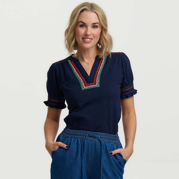 Model Wearing Sugarhill Brighton Luella Retro 60s Jersey Shirred Embroidered Top in Navy Zig Zags - Front View 1