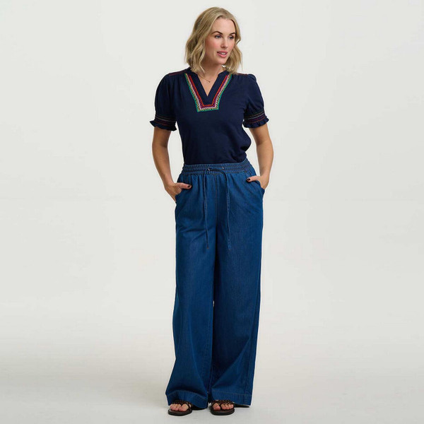 Model Wearing Sugarhill Brighton Luella Retro 60s Jersey Shirred Embroidered Top in Navy Zig Zags - Front View 2