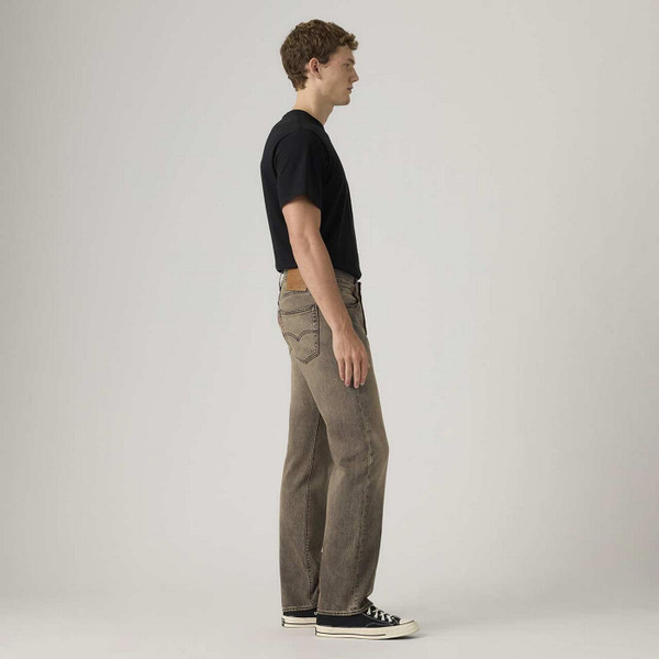 Model Wearing Levi's 501 Original Straight Denim Jeans in Ancient Space Overdye Brown - Side View