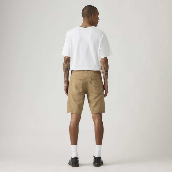 Model Wearing Levi's 501 Men's Retro Garment Dye Denim Shorts in Cardboard - Back View