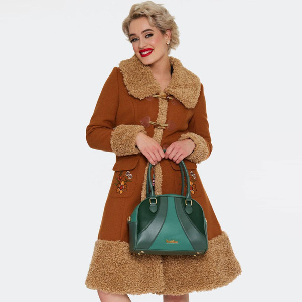 Model holding Voodoo Vixen Retro Mod Bowling Bag in Green