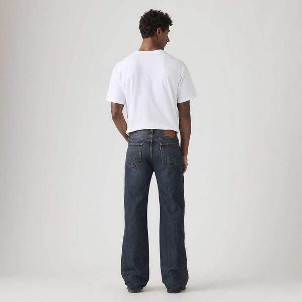 Model Wearing Levi's 567 Relaxed Fit Denim Flares in Vintage Bags Blue - Men's Flared Jeans - Back View