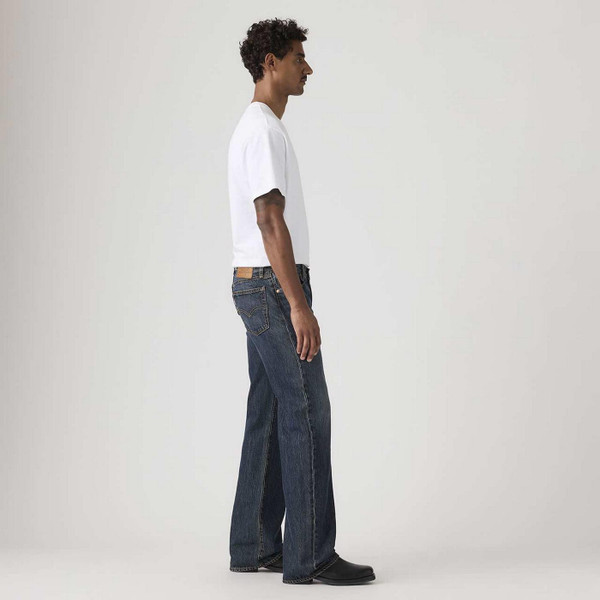 Model Wearing Levi's 567 Relaxed Fit Denim Flares in Vintage Bags Blue - Men's Flared Jeans - Side View