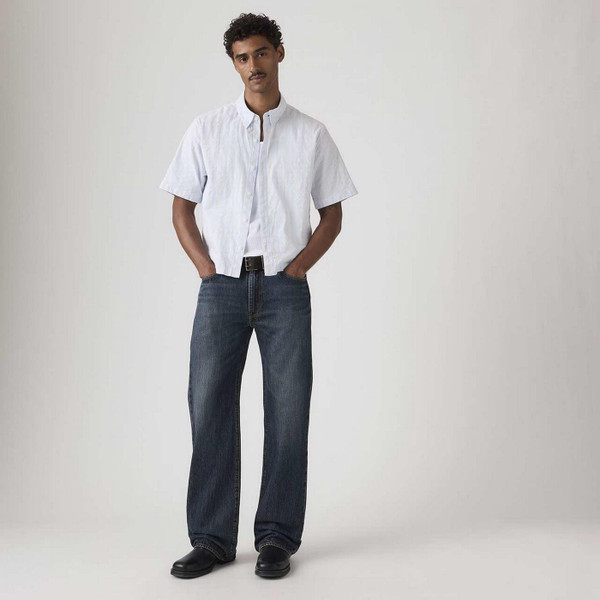 Model Wearing Levi's 567 Relaxed Fit Denim Flares in Vintage Bags Blue - Men's Flared Jeans - Front View 2
