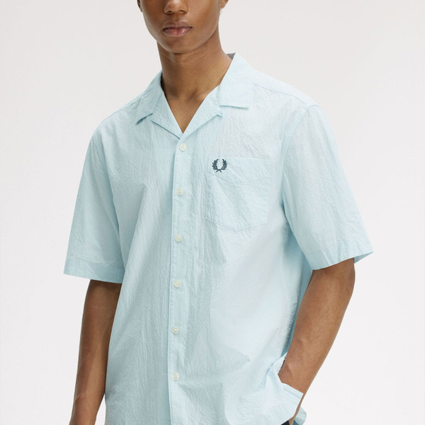 Man wearing Fred Perry Men's Retro 70s Seersucker Resort Collar Shirt in Light Ice