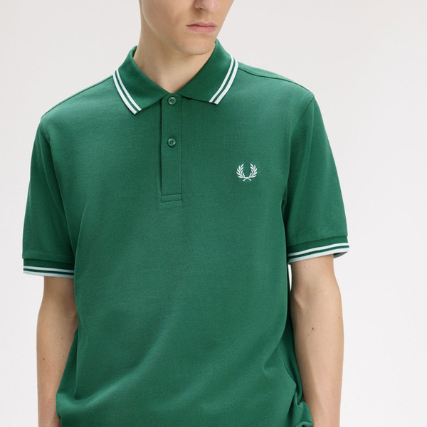 Man wearing Fred Perry M3600 Mod Twin Tipped Polo Shirt in Sport Green/Light Ice