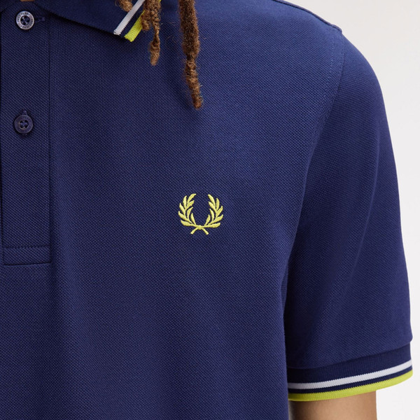 Laurel wreath logo on Fred Perry M3600 Mod Twin Tipped Polo Shirt in French Navy/Dusky Blue