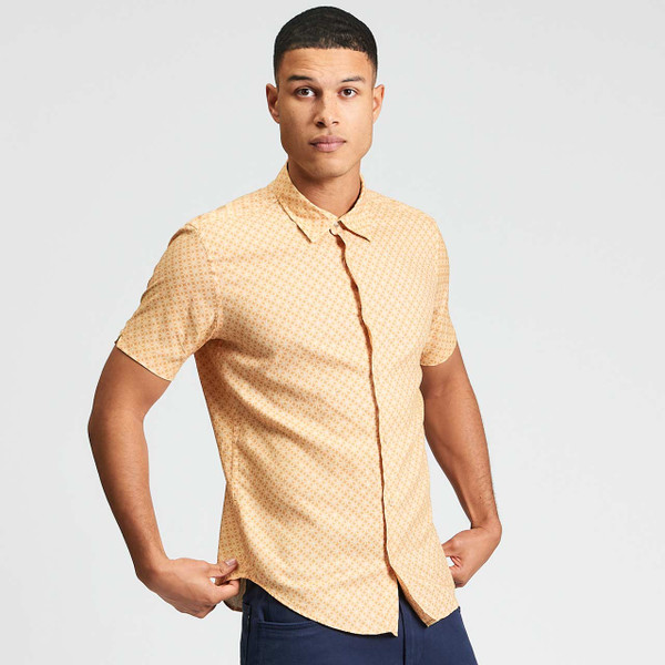 Man Wearing Ben Sherman Men's Mod Linear Geo Print Button Down Short Sleeve Shirt in New Gold - Front View