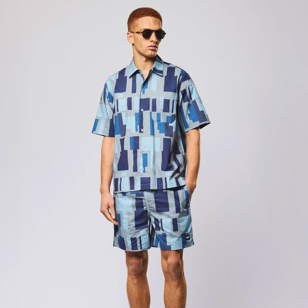 Man wearing Weekend Offender Ouzou Terrain Print Short Sleeve Shirt in Smokey Grey with matching shorts