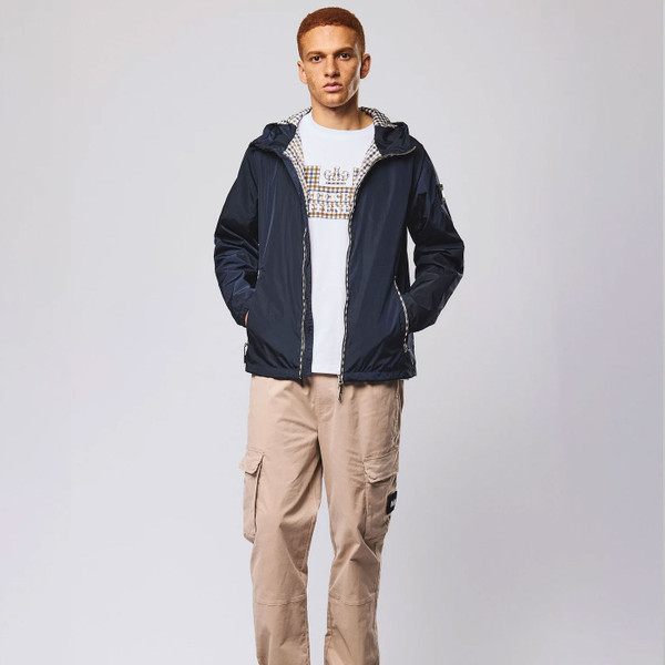 Man wearing Weekend Offender Campania Check Trim Windbreaker Jacket in Navy