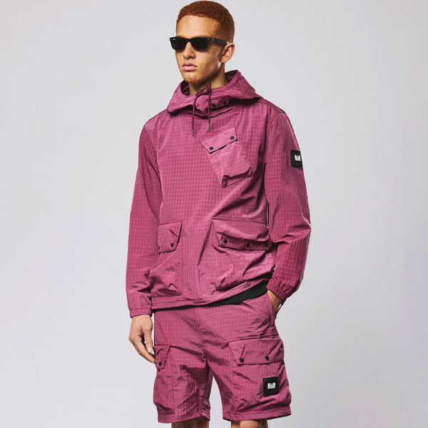 Man wearing Weekend Offender Grohl Overhead Men's Ripstop Hooded Jacket in Kirsch