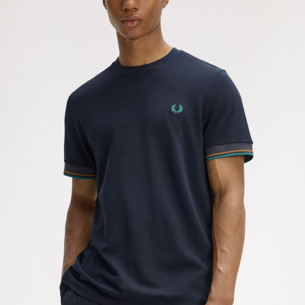 Man wearing Fred Perry Men's Mod Twin Tipped Cuff T-shirt in Navy