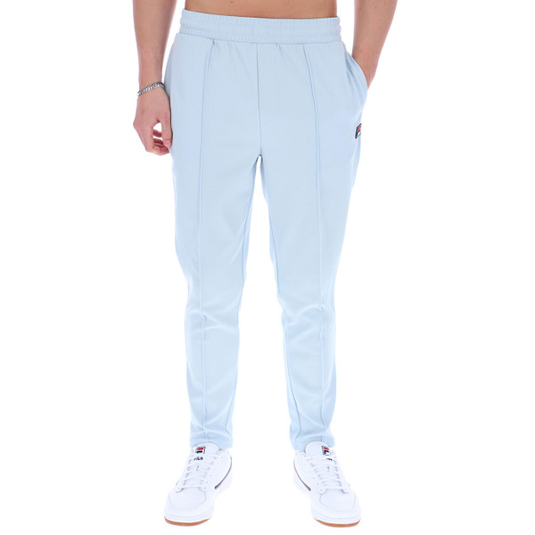 Man wearing Fila Vintage Mens Molveno Pin-Tuck Slim Leg Track Pants in Skyway Blue