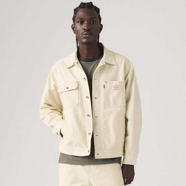 Model Wearing the Levi's Sunrise Men's Retro Workwear Denim Trucker Jacket in Undyed Ecru