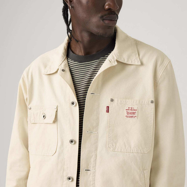 Model Wearing Levi's Sunrise Men's Retro Workwear Denim Trucker Jacket in Undyed Ecru - Close Up