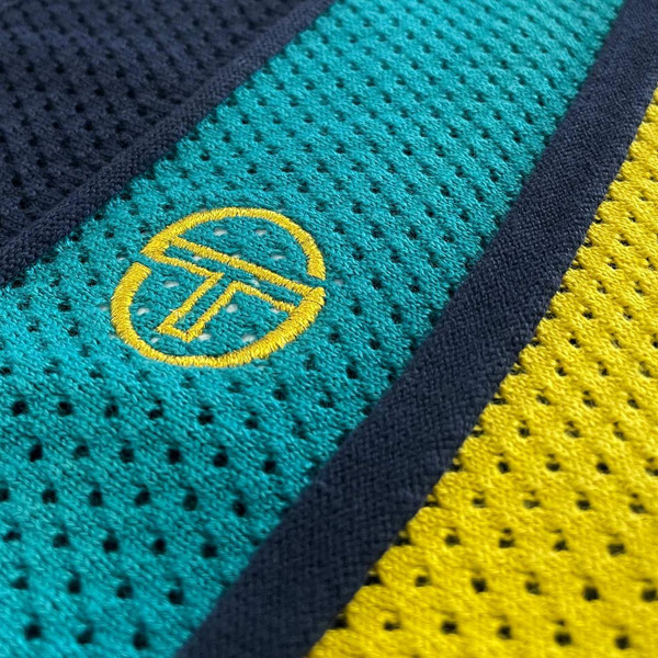 Sergio Tacchini Montell Retro 1980s Perforated Stripe Panel Button Through Knitted Polo Shirt in Maritime Blue - Fabric