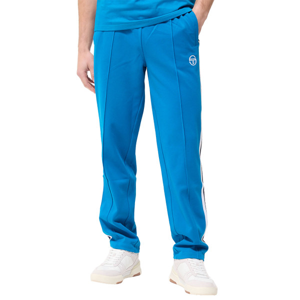 Man wearing Sergio Tacchini Franco Retro Woven Stripe Taped Track Pants in Blue