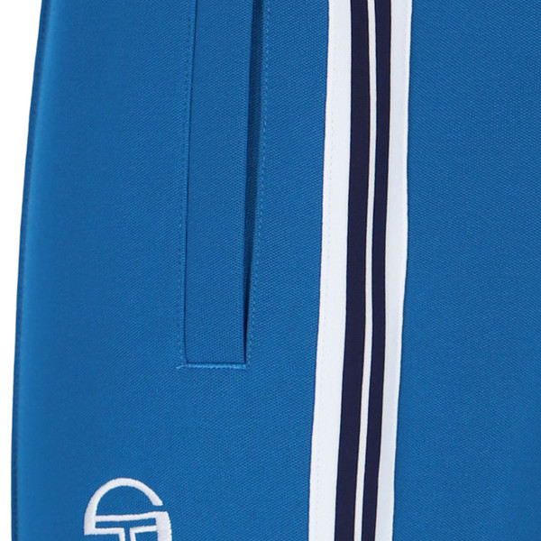 Side taping stripe on Sergio Tacchini Franco Retro Woven Stripe Taped Track Pants in Blue