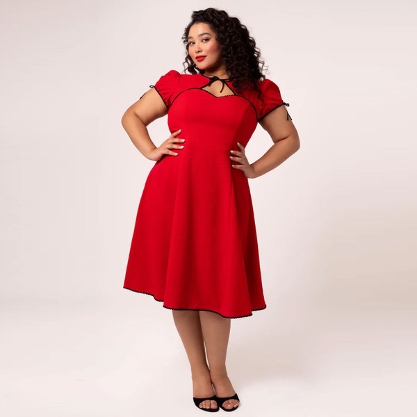 Woman wearing Hell Bunny Casey 50s Vintage Bolero Dress in Red