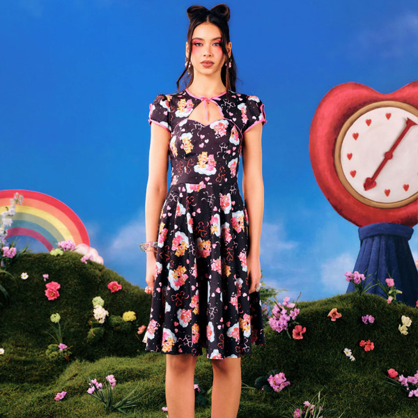 Woman wearing Hell Bunny x Care Bears Tenderheart Bolero Dress in Black