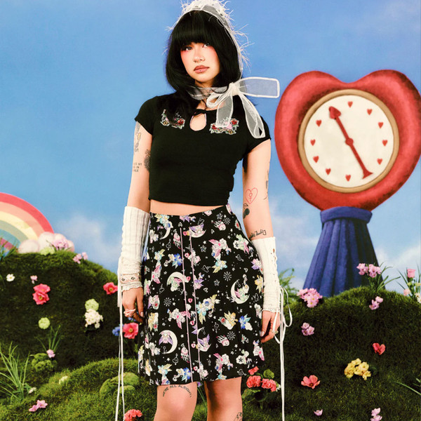 Woman wearing Hell Bunny x Care Bears Roxi 80s Skirt in Black