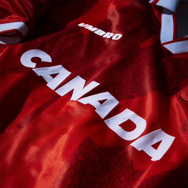 Umbro Tournament 2026 Canada Short Sleeve Football Jersey in Red - Country Name Close Up