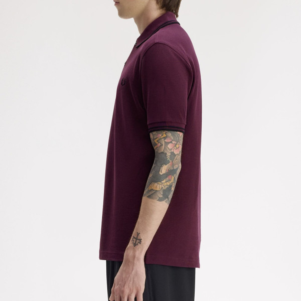 Model Wearing Fred Perry M3600 Mod Twin Tipped Polo Shirt in Black/Black/Black - Side View