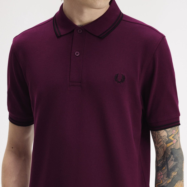 Model Wearing Fred Perry M3600 Mod Twin Tipped Polo Shirt in Black/Black/Black - Chest Close Up