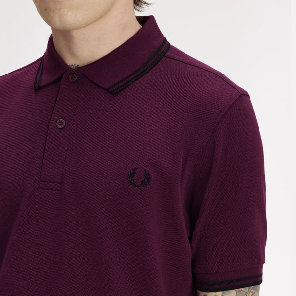 Model Wearing Fred Perry M3600 Mod Twin Tipped Polo Shirt in Black/Black/Black - Laurel Wreath Close Up