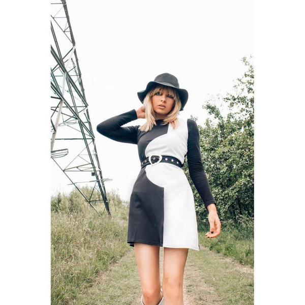 Model wearing the Madcap England Golightly black and white dress in a front lifestyle image