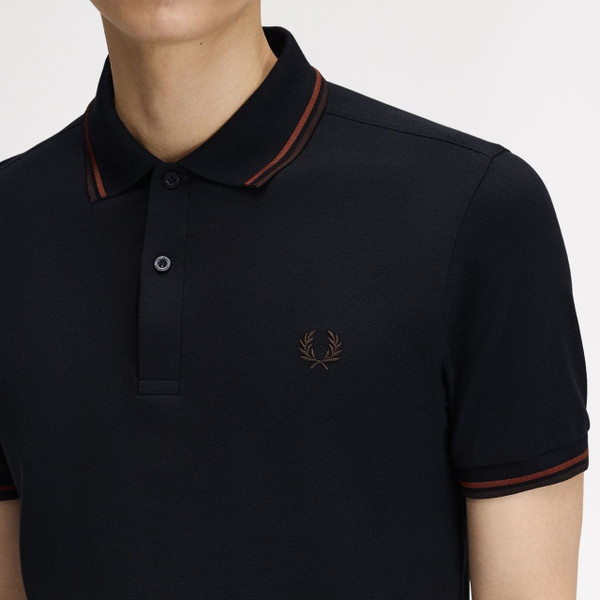 Model Wearing Fred Perry M3600 Mod Twin Tipped Polo Shirt in Navy/Brandy/Rich Brown- Front Close Up