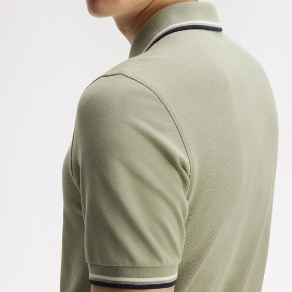 Model Wearing Fred Perry M3600 Mod Twin Tipped Polo Shirt in Seagrass / Ecru / Dark Airforce - Back Close Up