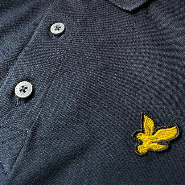Button Detail on the Lyle And Scott Pique Polo Shirt with Tartan Check Shoulder Yoke in Dark Navy