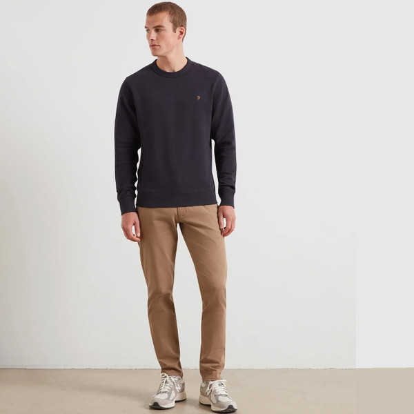 Model Wearing Farah Elm Slim Fit Organic Cotton Stretch Twill Chino Trousers in Beige - Full Length Front