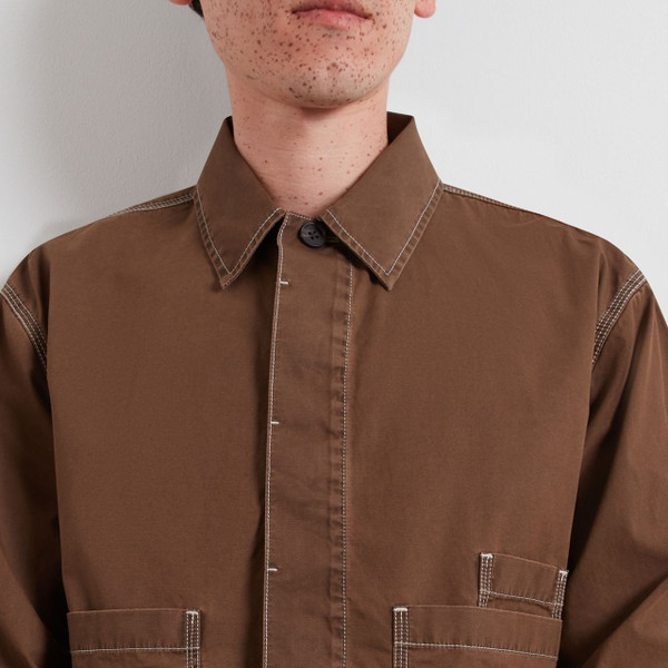 Model Wearing Farah Mattison Frost Finish Cotton Canvas Overshirt in Dark Brown - Front Facing  Close Up