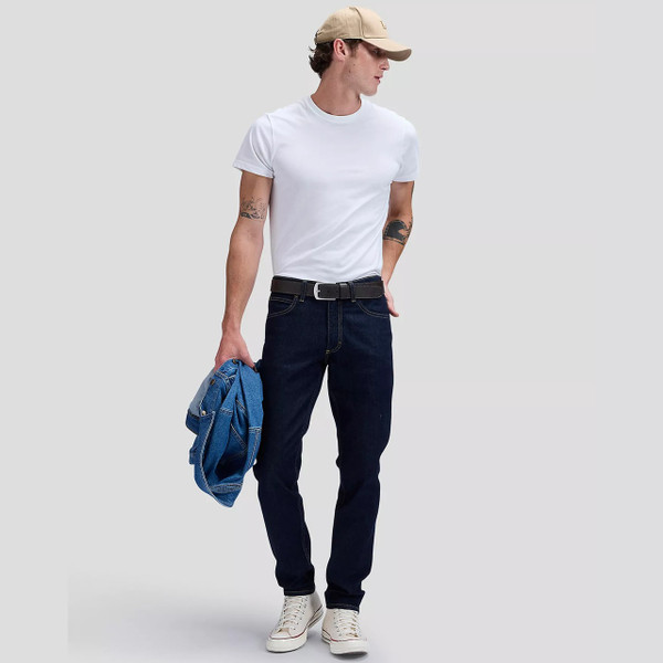 Model Wearing Lee Luke Slim Tapered Dark Indigo Denim Jeans in Rinse Raine - Front Facing Full Length Shot