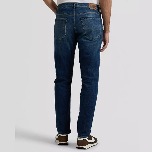 Model Wearing Lee David Men's Regular Tapered Blue Denim Jeans in Rusty Rivet - Back