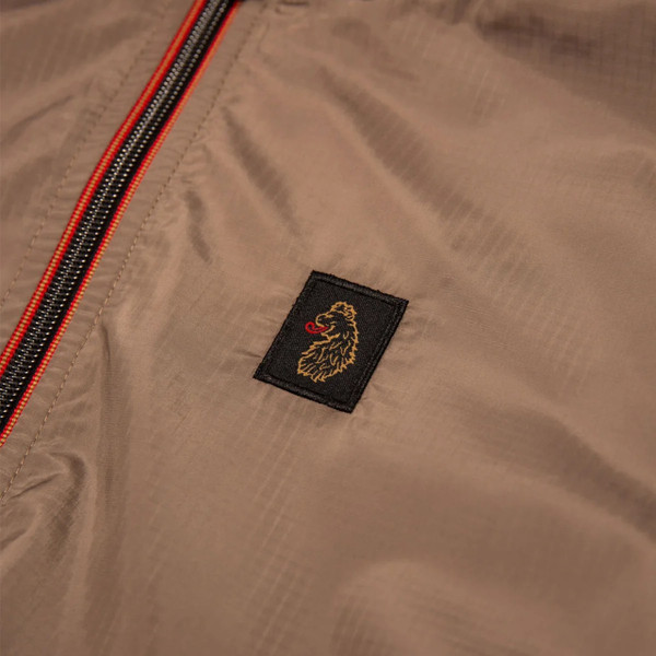 Luke 1977 Garnedd Men's Lightweight Hooded Nylon Jacket in Hardnut - Lions head motif close up