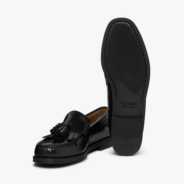Bass Weejuns Easy Layton II Kiltie Tassel Loafers in Black Leather - Pair of shoes one showing the sole
