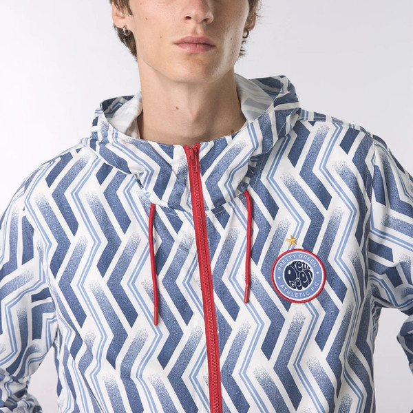 Model wearing Pretty Green Kingsleigh Men's Hooded Jacket in Blue - Front facing close up chest