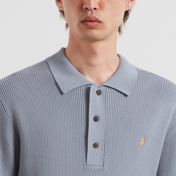 Model Wearing Farah Gerry Men's Retro Rib Knit Polo Shirt in Icelandic Blue - Front Facing Close Up Placket