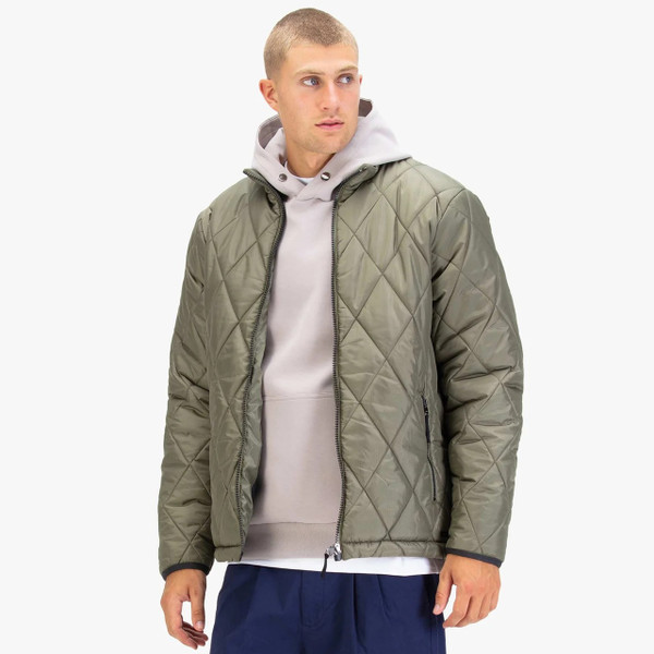 Model Wearing Luke 1977 Diamond Quilt Bubble Jacket in Clover - Front facing in hoodie