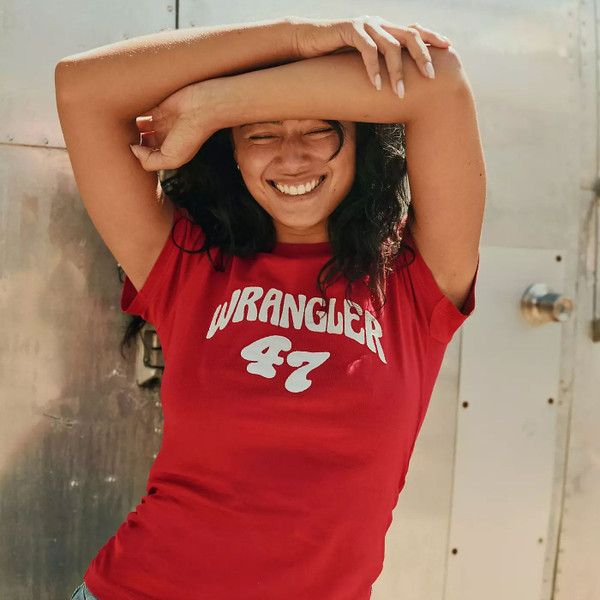 Lifestyle photo of Wrangler Women's Shrunken Band T-Shirt in Chili Pepper Red