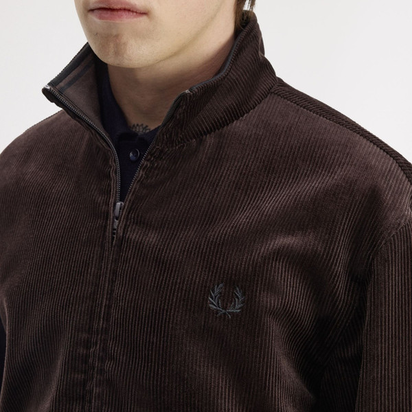 Model Wearing Fred Perry Men's Corduroy Brentham Jacket in Rich Brown - Close up unzipped collar